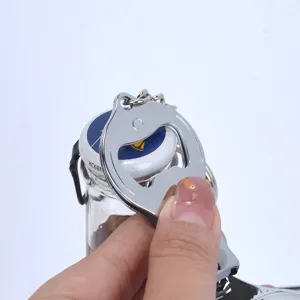 Close-up detail showing the stainless steel 3-in-1 nail clipper used as a bottle opener