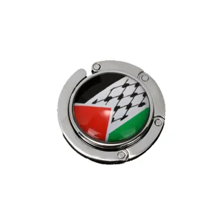 Portable foldable metal desk bag hook featuring a circular Palestine flag and keffiyeh pattern
