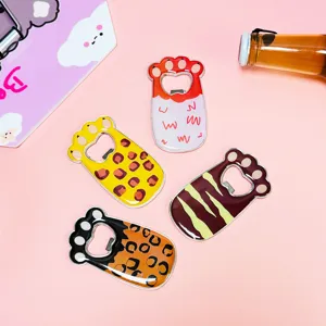 Detailed view of cat paw shaped fridge magnets with various colorful animal patterns