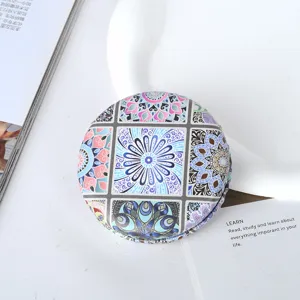 Close-up showing the intricate bohemian mandala pattern on a vintage foldable round PU pocket mirror
