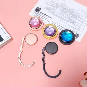 Portable metal folding handbag hooks with faceted crystal gems and colorful finishes