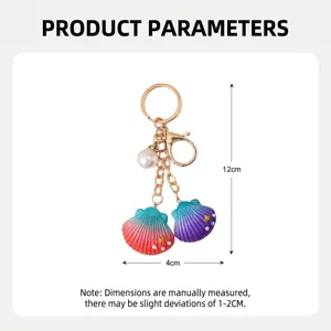 Elegant resin seashell keychain featuring gradient colors and a pearl charm detail