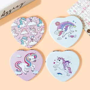 Detail showing four heart-shaped folding mirrors with cute unicorn illustrations.