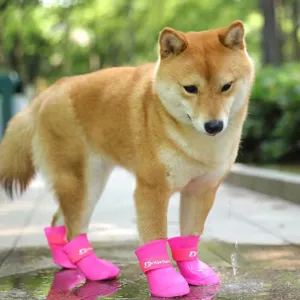Waterproof silicone dog rain boots set of 4, cute pink pet shoes for small dogs walking outdoors.