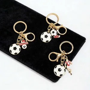 Detailed view of creative metal soccer keychains featuring enamel charms and sports figures