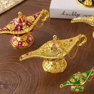 Ornate gold Aladdin magic lamps with embossed floral patterns for luxury home decor