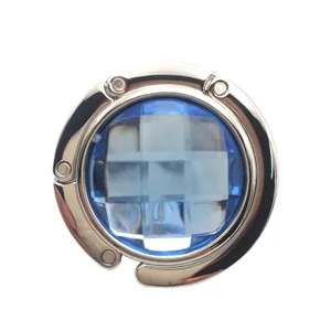 Portable foldable circular metal handbag hook with elegant blue faceted crystal center
