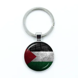 Round Palestine flag keychain pendant with vintage texture under glass cabochon.
