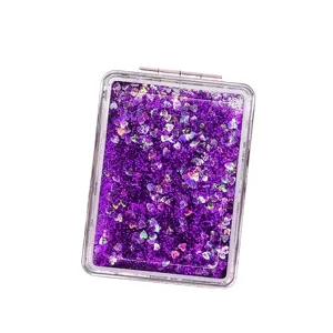 Portable purple quicksand folding makeup mirror with decorative heart-shaped glitter