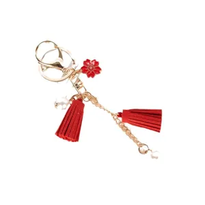 Elegant red cherry blossom tassel keychain featuring gold chain and delicate pearl bead accent