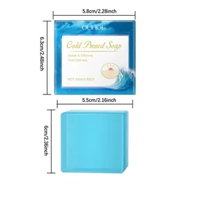 Détails du savon nettoyant facial pressé à froid OUHOE et de sa boîte avec dimensions.