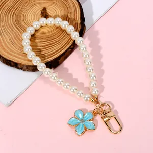 Elegant pearl chain phone lanyard with blue enamel flower charm and gold lobster clasp