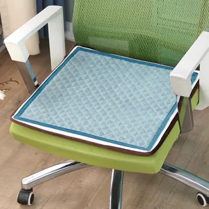 Close-up of blue quilted chair cushion detail, soft fabric seat pad for office chair.