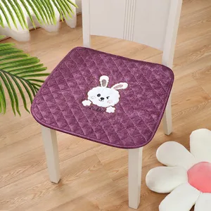 Purple chair cushion detail with cute rabbit embroidery, soft fabric and comfortable quilted design.