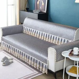 Quilted sofa cover with elegant lace ruffle skirt, thick breathable fabric for all seasons.