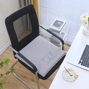 Grey memory foam seat cushion detail shot, breathable office chair pad with cute bear pattern.