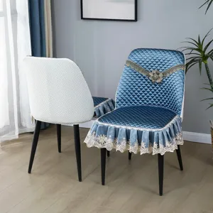 Quilted dining chair cover with elegant lace trim and luxury blue design, perfect for home decor.
