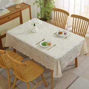 Elegant beige lace tablecloth with floral damask pattern, perfect for dining table decor.