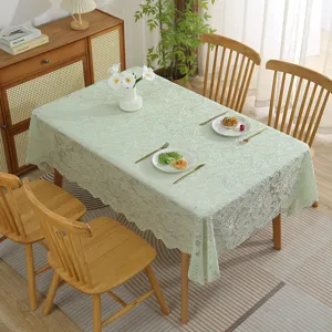 Elegant light green lace tablecloth for dining table home decor, delicate floral design.