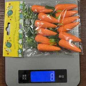Detail view of 10 artificial foam Easter carrots on a scale weighing exactly 8g