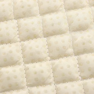 Close-up of quilted anti-slip seat cushion fabric with non-slip dots texture detail.