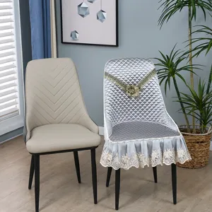 Detailed view of one-piece chair cushion with elegant lace trim and quilted design for home use.