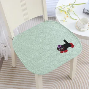 Light green chair cushion detail showing cute cat embroidery, non-slip design for home and office.