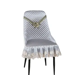 Grey quilted one-piece chair cover with lace embroidery and elegant ruffles for home dining.