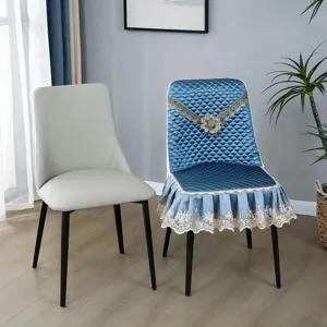 Quilted dining chair slipcover with lace ruffle, elegant blue all-season seat cover for home decor.