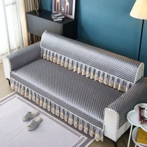 Quilted thickened sofa cover with delicate lace trim, stylish grey anti-slip living room cushion.