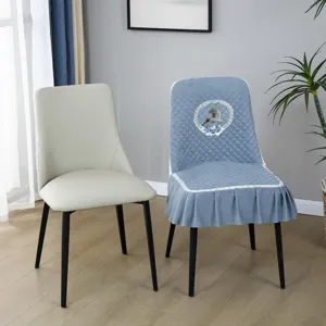 Quilted chair cover with lace trim and cute deer embroidery for dining room and home decor.