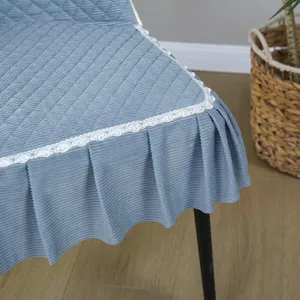 Blue quilted chair cover with lace trim, detailed view showing soft texture and elegant home decor fit.