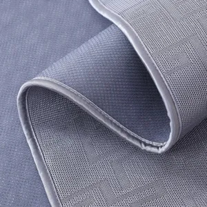 Grey rocking chair cushion detail texture, breathable mesh fabric with neat edge piping.