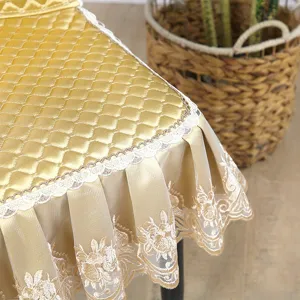 Gold quilted dining chair cover detail, elegant lace trim, anti-slip home seat cushion.