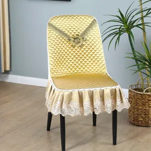 Gold quilted dining chair cover with lace trim and embroidered flower for home decoration detail