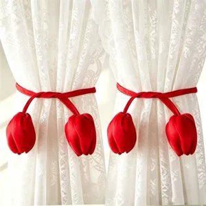 Red tulip curtain tiebacks with white lace curtains detail view, perfect for home decor and style.