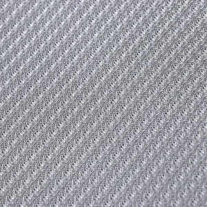 Gros plan sur le tissu de coussin de canapé en soie glacée avec des détails de texture.
