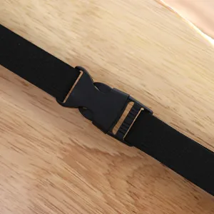 Close-up detail view of the black elastic strap and sturdy plastic buckle fastener.