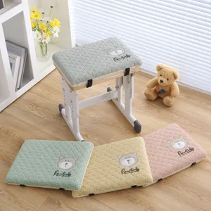 Student memory foam seat cushion with cute bear embroidery and plaid pattern design.