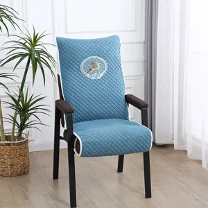 Detailed view of the blue quilted chair cover featuring elegant deer embroidery for home use.