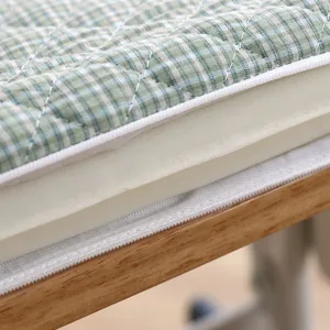 Thickened memory foam student seat cushion detail shot, green plaid quilted fabric cover.