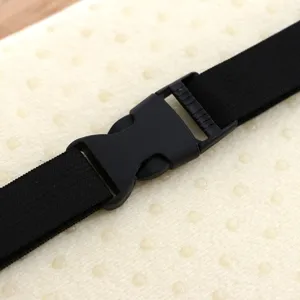 Close-up detail of the durable black plastic buckle and elastic strap on seat cushion.