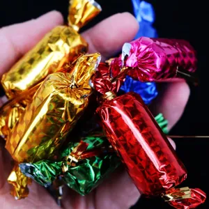 Close-up of colorful metallic foil-wrapped decorative Christmas candy ornaments