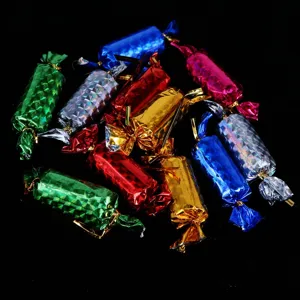 Close-up of colorful foil-wrapped simulation Christmas candy ornaments for tree decor.
