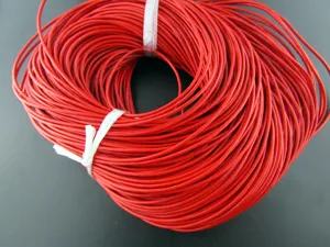 Detailed macro view of vibrant red leather cord coil for DIY jewelry crafting and beading