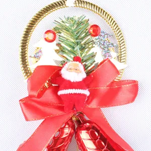 Detailed macro view of a festive 30cm Christmas bell ornament with Santa and red silk bow