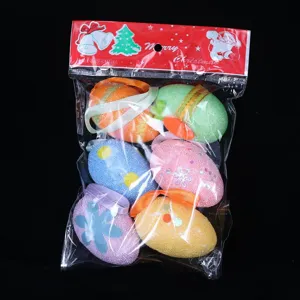 Detail view showing six colorful glittery foam Easter eggs in clear hanging packaging
