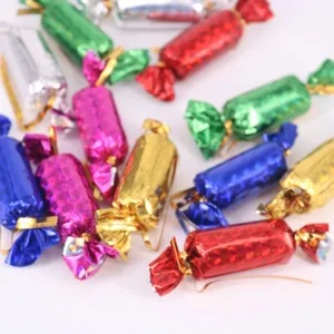 Detailed view of colorful metallic foil-wrapped Christmas candy ornaments for tree