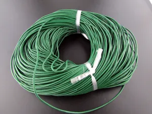 Detailed view of a durable dark green cowhide cord coil for DIY jewelry and necklaces
