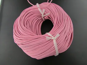Macro view of pink round cowhide leather cord coil for DIY jewelry making and crafting.
